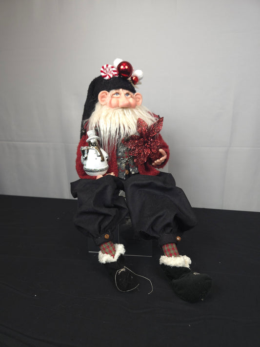 Santa Doll Holding Snowman Ornament and Poinsettia