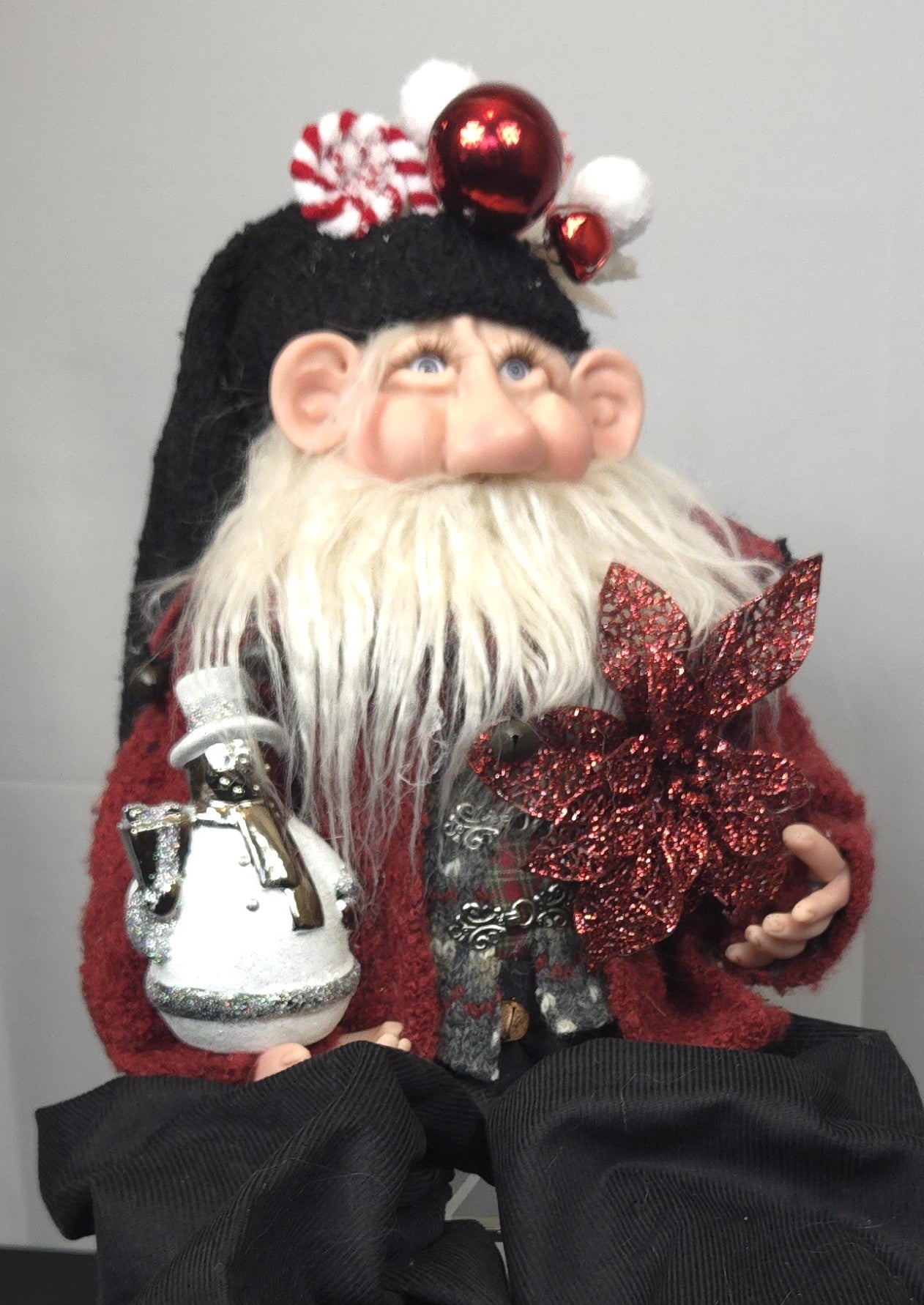 Santa Doll Holding Snowman Ornament and Poinsettia