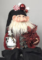 Santa Doll Holding Snowman Ornament and Poinsettia